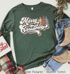 Retro Vintage Style Merry Christmas Tee or Sweatshirt #ChristmasGift #ChristmasHoodie #ChristmasMatching #ChristmasPajamas #ChristmasShirt #ChristmasSweater #ChristmasSweatshirt #ChristmasTreeShirt #FamilyChristmasTee #FamilyMatching #FunnyChristmasTee #HolidaySweatshirt #HolidayTee #MatchingChristmas #MerryAndBright #MerryChristmasTee #PersonalizedGifts #SantaShirt #WomensChristmas #MonogramChristmasShirt Festive Long Sleeve T-shirt For Holiday, Festive Long Sleeve Holiday T-shirt, Festive Long Sleeve Christmas T-shirt, Long Sleeve Christmas Holiday Shirt, Green Holiday Top For Christmas, Green Christmas Holiday Top, Long Sleeve Graphic T-shirt For Holidays, Holiday Long Sleeve Shirt With Graphic Print, Holiday Green Tops With Letter Print