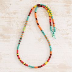 This long, colorful necklace is the original creation of Mirian Zet in Guatemala. She crafts the necklace by hand with tiny glass beads in aqua, orange, red and yellow, inspired by the colorful blooms and tranquil waters that surround her home country. Nice Necklaces, Diy Santa, Colorful Necklace, Blue Beaded Necklace, Wire Wrapped Bracelet, Beaded Wrap Bracelets, Jewelry Techniques, Beaded Wraps, Glass Beaded Bracelets