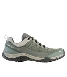 a women's hiking shoe in grey and white