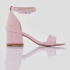 The Pink Patent Sandal-Strap Heels designed by Perla are the perfect choice for special occasions and dressing up. These elegant shoes feature a block heel that provides stability and a sandal buckle strap for a snug fit, ensuring comfort throughout the day. The matching strap across the front of the foot adds a touch of sophistication to the design, while the gold logo print on the sole adds a hint of luxury. Ideal for parties, weddings, or any formal event, these Pink Heels will make any outfit stand out. Crafted with attention to detail and style, these heels are a must-have addition to any young fashionista's wardrobe. The Pink Patent Sandal-Strap Heels designed by Perla for kid girls combine elegance and practicality, making them a versatile and stylish choice for any special occasion Heels Pink, Elegant Shoes, Pink Heels, Gold Logo, Designer Heels, Block Heels Sandal, Strap Heels, Girls Accessories, The Pink