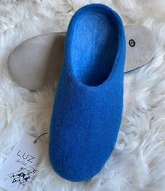 Super warm and soft, our 100% natural felt wool slippers are so warm and comfy, you will not want to take them off! Handmade boiled wool slip-ons made by skilled artisans in a small fair trade workshop in Nepal. - Material: 100% New Zealand Wool - Soles: 100% Suede - Colour: Deep Ocean Blue - Size: 8, 9, 10, 11, 12 UK (42, 43, 44, 45, 46 EU)- will also fit 1/2+ UK as the slippers are flexible and will give slightly to mould to your feet - Style: Mule slip-on About us- LUZ Fair Trade  is a small Blue Slides, Felt Wool Slipper, Wool Accessories, Moccasin Slippers, Wool Slippers, Deep Ocean, Moccasins Slippers, Boiled Wool, Mens Slippers