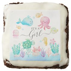 it's a girl cake with sea animals and fish on the frosted icing