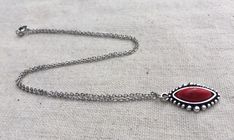 "Simple, chic and versatile! Here is a red stone necklace that is set in a perfectly detailed silver frame. The perfect everyday necklace! Made from allergy free plated silver. The pendant measures 1\" long by 1/2\" wide. It hangs from a shiny strong 18\" stainless steel necklace chain with a lobster clasp. I have matching earrings in my shop if you would like the whole set. Here is the link https://etsy.me/2R5NsWx I have this same style pendant necklace available in other color ways as well! He Southwestern Style Red Necklace For Gift, Red Bohemian Teardrop Necklace, Red Southwestern Turquoise Necklace For Gift, Nickel-free Southwestern Style Necklace As Gift, Southwestern Style Nickel-free Necklace For Gift, Red Southwestern Sterling Silver Necklace, Southwestern Style Teardrop Pendant Jewelry Gift, Red Southwestern Style Jewelry Gift, Southwestern Style Red Jewelry For Gift