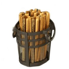 a metal basket filled with wooden sticks on top of a white surface and black handles