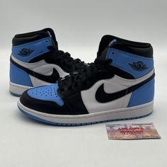 Elevate your sneaker game with these stylish and iconic Air Jordan 1 Retro OG High UNC Toe sneakers. Crafted with premium leather in a sleek black, white, and blue colorway, these sneakers are perfect for any athletic or casual occasion. The high-top shoe shaft style provides extra support and the UNC toe design adds a touch of sophistication. These sneakers feature the classic Air Jordan logo and style code DZ5485-400. They are available in a men's US shoe size 8 and are part of the Air Jordan product line. Whether you're a fan of the retro theme or simply looking for a comfortable and stylish sneaker, these Air Jordan 1s are a must-have addition to any collection. No box Air Jordan 1s, High Top Shoe, Jordan Logo, Black Jordans, Jordan 1s, Retro Theme, Sneaker Games, Air Jordan 1 Retro, Jordan 1 Retro