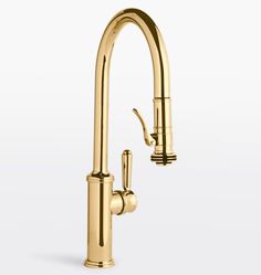 a gold faucet with two handles and nozzles on the side, in front of a white background