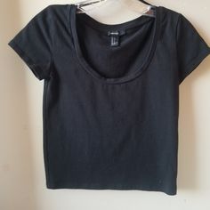 Forever 21. Black Semi Cropped Tee. Fits At Waist, Or Right Above On My 5ft Girl So If Your Tall It Will Be Shorter. Size S. Never Worn. Scooped Neck. Black Cotton Scoop Neck Crop Top, Trendy Scoop Neck Tops For Streetwear, Forever 21 Black Short Sleeve Top, Forever 21 Cotton Tops For Streetwear, Forever 21 Black Crop Top, Forever 21 Black Cotton Tops, Forever 21 Black Short Sleeve T-shirt, Forever 21 Casual Crop Top For Streetwear, Forever 21 Black Crew Neck T-shirt