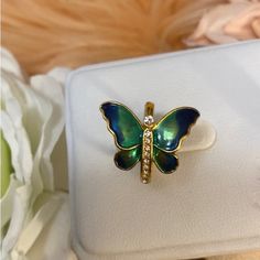 Metallic Green & Blue Butterfly Ring With Cz Accent Diamonds Butterfly Sits Sideways Green & Blue Tarnish Free 14k Dipped Comes In Gift Box Offers Encouraged Unless Marked Firm Blue Diamond Jewelry For May Birthstone, Blue Butterfly Ring, Butterfly Ring, Blue Butterfly, Womens Jewelry Rings, Colored Diamonds, Blue Green, Gift Box, Diamonds