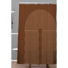 a brown shower curtain with wavy lines on the front and back of it in an oval shape