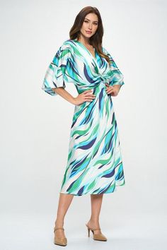 Made in USA Satin Stretch Print Dress with Front Twist. Available in other Colors. Fabric content: 97% Polyester, 3% Spandex. Style: casual, formal, work Print / Pattern: abstract print Silhouette: a-line Fit: regular Neck Line: v neck Sleeve: shortsleeve Length: maxi Lining: no Made In: Made in U.S.AFabric Contents: 97% Polyester, 3% Spandex. Size Measurement (inch): S: 18.5 (Bust), 13.5 (Waist), 20.0 (Hips), 50.5 (Length) M: 19.5 (Bust), 14.5 (Waist), 21.0 (Hips), 51.0 (Length) L: 20.5 (Bust), 15.5 (Waist), 22.0 (Hips), 51.5 (Length) Multicolor Surplice Neckline Midi Dress For Spring, Spring Multicolor Midi Dress With Surplice Neckline, Blue Floral Print Midi Dress For Work, Blue Floral Midi Dress For Work, Elegant Maxi Dress With Abstract Print For Spring, Elegant Abstract Print Maxi Dress For Spring, Spring Knee-length Dress With Abstract Print, Elegant Spring Maxi Dress With Abstract Print, Elegant V-neck Maxi Dress With Abstract Print