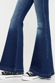 Our Cinthia Ultra High Rise Jeans come in a superflare cut with a raw, released hem that creates a chic, rustic look. Sits high above the natural waistline as it tapers down the thigh and begins to flare out at the calf. Made with stretch denim that holds its shape and allows you to move with ease. Features a classic five-pocket design, single-button front, and zip-fly closure. 11.25" Rise / 33.5" Inseam (Size 3/25) 68% Cotton, 27% Polyester, 3% Rayon, 2% Spandex Model in size 3/25 Style # : KC7896D Style # : KC7896M Stretchiness Level >> Stretch Super Flare Jeans, High Rise Jeans, Pocket Design, Flare Jeans, Stretch Denim, Dark Blue, High Rise, Spandex