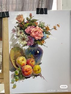 an easel with a painting of flowers on it