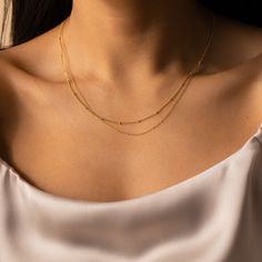 B E A D E D ∙ D U O ∙ C H A I N ∙ N E C K L A C E Get two in one with our minimalist Beaded Duo Chain necklace. With one satellite chain and one dainty chain layered together, this choker necklace gives the illusion that you put in the extra effort when you really spent the extra time in bed. * Material: High Quality Solid 925 Sterling Silver * Finish: Sterling Silver ∙ 18K Gold * Featuring a Minimalist Chain layered with a Dainty Beaded Chain, adjustable length 16 inches to 18 inches. H O W ∙ T Minimalist Double Strand Layered Necklace, Minimalist Double Strand Clavicle Chain Layered Necklace, Minimalist Beaded Chain Layered Necklace, Minimalist Everyday Beaded Chain Layered Necklace, Minimalist Double Strand Layered Necklace With Adjustable Chain, Minimalist Double Strand Delicate Chain Necklace, Minimalist Layered Necklace With Satellite Chain, Minimalist Beaded Chain Layered Necklace As Gift, Minimalist Double Chain Necklace