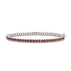 Richly hued round garnets adorn this sophisticated bangle fashioned in classic sterling silver. The bracelet measures 7.25 inches and secures with a box clasp. Classic Formal Bangle With Gemstone, Elegant Stackable Garnet Jewelry, Elegant Garnet Bracelets For Formal Occasions, Classic Gemstone Bangle Bracelet, Classic Sterling Silver Bracelet With Gemstone, Classic Round Sterling Silver Bracelet With Gemstone, Classic Sterling Silver Gemstone Bracelet, Classic Sterling Silver Gemstone Bracelet For Formal Occasions, Classic Gemstone Bangle For Anniversary