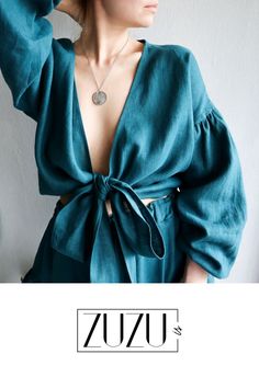 A romantic look, wrap blouse with long puffed sleeves. The color of the wrap top is QUETZAL GREEN. The model is 170 cm (5'6.929") and wears the size L. Linen wrap top.Linen blouse.Kimono top.Puffed sleeves blouse.Wrapped top.Soft linen blouse.Linen wrap crop top.Boho wear.All seasons wear. Summer Linen Top With Lantern Sleeves, Linen Lantern Sleeve Tops For Summer, Fall Wrap Top For Brunch, Fall Season Wrap Top For Brunch, Fall Brunch Wrap Top, Summer Wrap Top For Brunch, Summer Brunch Wrap Top, Bohemian Blouse With Gathered Sleeves, V-neck, Summer Wrap Blouse With Tie Sleeves