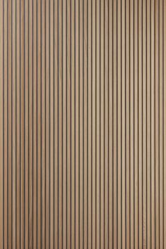 a brown wall with vertical lines on it