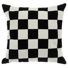 a black and white checkered pillow on a white background