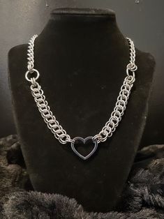 This dainty heart necklace is the perfect accessory. Whether for yourself or someone you love, this piece is made to be cherished.  Hand weaved in the half Persian Chainmaille weave and connected at the center with a Cuban chain. Made entirely from high quality stainless steel materials.  This piece is made to last a lifetime and can be worn in the shower or pool without issues.  large lobster claw clasp for closure. Length-  15 inches- choker  ( be sure to measure your neck) 16 inches- short ne Valentine's Day Double Heart Metal Chain Necklace, Heart Shaped Metal Necklace With Silver Chain, Heart-shaped Metal Necklace With Silver Chain, Heart Shaped Silver Chain Necklace, Heart-shaped Silver Chain Necklace, Stainless Steel Double Heart Jewelry With Adjustable Chain, Metal Necklace With Open Heart And Adjustable Chain, Silver Heart Necklace With Adjustable Chain In Stainless Steel, Double Heart Metal Chain Necklace