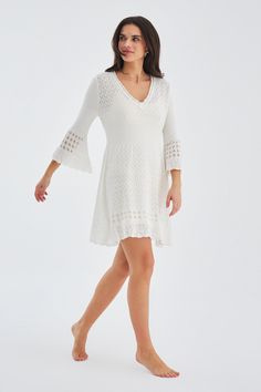 Crafted from the most comfortable knit material, it is gentle on your skin and perfect for all-day wear. The flattering V-neck design accentuates your features, allowing you to exude confidence with every step.  What sets this dress apart is the intricate openwork detailing. This unique feature adds a touch of sophistication and elegance to the dress, allowing you to make a statement wherever you go.  The Yoho Openwork V-Neck Knit Dress is available in various sizes and colors, ensuring there is White Stretch V-neck Sweater Dress, White V-neck Loungewear Dress, Casual Crochet Dress With Pointelle Knit And V-neck, Elegant Pointelle Knit Crochet Dress For Vacation, Cream Fitted V-neck Sweater Dress, White V-neck Sweater Dress, Chic Crochet Open Knit V-neck Dress, White Stretch Sweater Dress With V-neck, Chic V-neck Sweater Dress For Loungewear