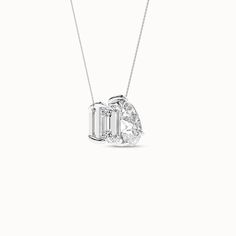 The emerald-cut diamond, with its step-cut facets and pear-cut diamond's graceful curves, creates a captivating core that adds a touch of uniqueness to the necklace. Crafted with love, the diamonds are securely held in a prong setting. The design of this Toi et Moi necklace transcends trends, making it a timeless piece that you can cherish for generations to come. Pear-shaped Baguette Diamond Jewelry, Pear-shaped Baguette Diamond Jewelry For Gift, Pear-shaped Jewelry With Baguette Diamonds For Gift, Teardrop Baguette Diamond Jewelry, Gift Jewelry With Pear-shaped Baguette Diamonds, Luxury Pear-shaped Jewelry With Baguette Diamonds, Pear Cut Diamond, Step Cut, Pear Diamond