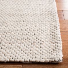 a white rug is laying on the floor