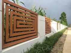 the fence is made of wood and white walls