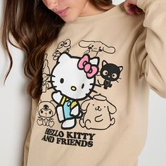 If you love a good Hello Kitty moment, you'll enjoy adding this women's and junior's long-sleeve sweatshirt to your casual wardrobe. It features Hello Kitty herself at the front surrounded by her friends against a neutral-colored backdrop. The pullover is made from a fleece cotton-blend for a cozy feel and has a regular-fit, a crew neck, drop shoulders, and a tag-free design.Features: Tag FreeCharacter: Hello KittyClosure Type: Pullover HeadFit: Regular FitNeckline: Crew NeckSleeve Length: Long… Trendy Hello Kitty Cotton Sweatshirt, Trendy Cotton Sweatshirt With Hello Kitty Print, Trendy Hello Kitty Print Crew Neck Sweatshirt, Cute Cotton Sweatshirt With Hello Kitty Print, Kuromi Sweatshirt, Kuromi Clothes, Character Collage, Hello Kitty Sweatshirt, Kitty Clothes