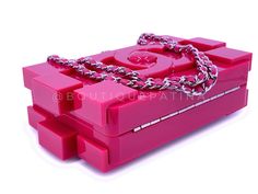 Chanel 2014 Pink Lego Brick Minaudière Plexiglass Clutch Shoulder Bag with woven chain in shiny ruthenium hardware.Woven chain can be tucked/hidden inside or carried as a crossbody.Dimensions are for the outside of the bag - will not carry an iPhone.In fuchsia pink plexigalss and shiny ruthenium hardware. Established 19 years ago, Boutique Patina has specialized in sourcing and curating the best condition preowned vintage Chanel leather treasures by searching closets around the world.Measures 8in. W (at widest point) x 4.7in. H x 2.5in. D Chanel 2014, Woven Chain, Chanel Purse, Small Boutique, Lego Brick, Exclusive Bag, Fuchsia Pink, Beautiful Packaging, Fendi Bags