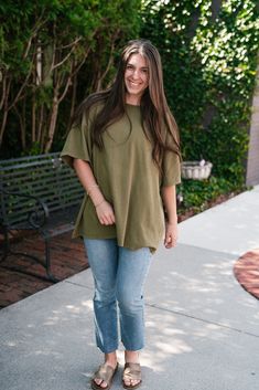 Unwind and relax in our Lounge Around Mineral Wash Oversize Tee in Moss. With a drop shoulder, short sleeves, and a relaxed fit, this tee is perfect for lounging at home or out on the town. The mineral wash gives it a unique look and feel, adding a touch of style to your comfort. The Fabric: 100% cotton Product Details: Relaxed, oversized fit. Mineral wash. Drop shoulder. Model shown wearing a size small. Oversized Soft-washed Tops For Day Out, Oversized Washed Tops For Day Out, Oversized Soft-washed Relaxed T-shirt, Oversized T-shirt For Casual Gatherings, Summer Relaxed Fit Short Sleeve Top, Oversized Casual Short Sleeve Top For Loungewear, Casual Oversized Short Sleeve Top For Loungewear, Casual Relaxed Fit Short Sleeve Top For Loungewear, Comfortable Short Sleeve Top For Casual Gatherings