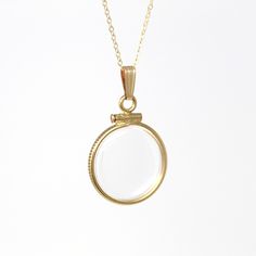 Timeless handcrafted brand new 14k gold filled empty shaker locket necklace! This classic pendant is dime sized with coin style bezels, and clear lucite covers. The round charm is shown modeled on a brand new 14k gold filled 20" chain, and is ready to be filled with your favorite gemstones, photos or keepsakes. An incredible piece of brand new jewelry, ready to hold your special findings!  ERA - Brand New METAL / MATERIAL - 14k gold filled locket, 14k gold filled chain, lucite clear covers, 1 screw (can be open and closed with a small screwdriver) MARKINGS / HISTORY - Bail is marked "1/20 14K G.F." on inside, chain is marked "14/20 G.F."    CONDITION - Excellent handcrafted brand new condition. The locket can be securely opened and closed with a small screw driver, such as ones intended fo Brass Round Charm Necklaces, Brass Charms Necklace With Round Shape, Brass Charms Necklace, Round Brass Necklaces With Charms, Heirloom Brass Necklace For Keepsake, Nickel-free 14k Gold Round Pendant Jewelry, Nickel-free 14k Gold Round Pendant, 14k Gold Nickel-free Round Pendant, Yellow Gold Brass Necklace For Keepsake