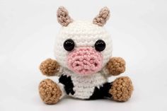 a crocheted stuffed animal sitting on top of a white table