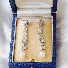 Beautiful diamond earrings, rare and full of nobility, set in platinum. From the Belle Époque period, translated as "the beautiful era," these earrings are a unique item for collectors and connoisseurs, featuring real diamonds and natural pearls in platinum. The earrings have a stud design with the appearance of dangling earrings, offering an elegant length that adds beauty and softness to the look. Set with diamonds and gold engravings, the mesmerizing lace decorations culminate in a round pearl at the end, perfectly finishing the elegant design. Crafted from platinum with rare diamonds, these earrings weigh 5.1 grams and measure 4 cm in length. They capture the essence of antique Belle Époque era jewelry, blending vintage style from the 1920s with the timeless elegance of old diamond ear Lace Decorations, Rare Diamonds, Beautiful Diamond Earrings, Natural Pearl Earrings, Stud Design, Pearls Earrings, Earrings Antique, Lace Decor, Gold Engraving