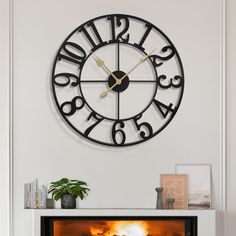 a fireplace with a clock on the wall above it that reads 3 20 and has fire coming out