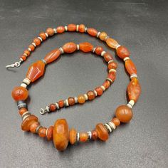 Beautiful Ancient Indo-Tibetan Carnelian And Banded Agate Beads Necklace. The Age Of This Beads More Than 1000 Years From Ancient Himalayan Cultures Civilizations. The Carnelian Beads Got Very Beautiful Color And Very Smooth Skin Its Because Of Long Passage Of Time Using. Conditions Of Beads As Shown In The Pictures. Quite Long String Necklace Many Beads In The Strings. Bohemian Carnelian Round Bead Necklace, Bohemian Carnelian Beads For Jewelry Making, Bohemian Carnelian Beads With Natural Stones, Bohemian Carnelian Gemstone Beads, Bohemian Carnelian Beads And Cabochons, Bohemian Carnelian Beaded Necklace With Polished Beads, Bohemian Amber Agate Beads, Bohemian Polished Carnelian Beads, Bohemian Amber Oval Beads, Gems And Cabochons