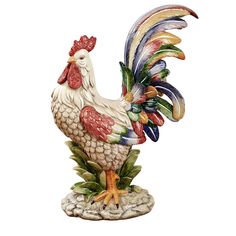 a colorful rooster figurine sitting on top of a wooden table