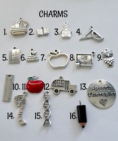 various charms are shown on a table with numbers and symbols around them to spell out the word charms