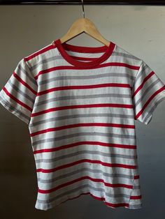 "Vintage striped t-shirt from the 1950s / 1960s - Has some wear throughout  16\" Pit to Pit  19.5\" Length All sales final, please ask any questions before buying - Thanks!" Red Short Sleeve Tops With Vertical Stripes, Red Cotton Top With Vertical Stripes, Red Cotton Tops With Vertical Stripes, Retro Striped Short Sleeve T-shirt, Vintage Striped Short Sleeve T-shirt, Vintage Striped Cotton T-shirt, Retro Cotton Tops With Vertical Stripes, Vintage Cotton Tops With Vertical Stripes, Vintage Cotton Top With Contrast Stripes