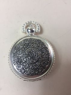 Welcome to my shop.  For sale is this wonderful vintage Sorge chrome and steel pocket-watch/fob-watch. The cover of the watch has a lovely design and the back of the watch is a see-through skeleton view. It measures 2 inches in diameter. This would make a lovely gift for the collector, or for yourself! Should you buy more than one item I'm also happy to combine the shipping cost.  Please have a look at my other items in my shop. BestFrenchBargains Best French bargains does not accept cancellations on any orders so please make sure you are committed  to your purchase before placing a order all returns shipping charges are at the buyers expense and refunds for the original shipping is also at the buyers expense all items must be returned within 14 days in the original packaging and must be s Vintage Pocket Watch With Metal Dial Gift, Vintage Silver Pocket Watch With Metal Dial, Vintage Silver Pocket Watch With Compass Design, Vintage Metal Pocket Watch Engraved, Vintage Metal Engraved Pocket Watch, Silver Metal Pocket Watch With Compass Design, Vintage Pocket Watch With Compass Design, Vintage Engraved Metal Pocket Watch, Vintage Pocket Watch With Metal Dial