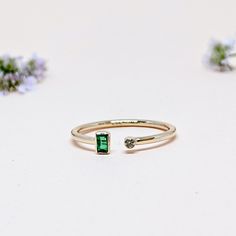 14K Solid Yellow GOLD Stackable Ring One of a Kind Everyday Open Cuff Ring in 14k Gold For Her from our Capsule Jewelry Collection. NATURAL EMERALD and DIAMOND Open Cuff Ring in 14k SOLID YELLOW GOLD. Emerald Rectangular Faceted Stone and Diamond is set in Bezel Setting in our Factory. Gold Ring AAA+ Quality Emerald Diamond Precious Gemstone Ring. Etsy Handmade Jewelry, Handmade Ring For Wedding Gift , Engagement Gift  Anniversary Gift (Stamped 585 /14k ) Ring. Perfect Gift For Everyday or Gift for a May Birthstone for Your Loved Ones. ►  DIMENSIONS : ◆ Gemstone : Emerald and Diamond                                                            ◆ Stone size : 4*2 mm  ◆ Gross Weight : 1.160 grams ◆ Stone Weight :  Emerald 0.11 Ct                                                         :  Diamo May Birthstone Baguette Cut Diamond Rings, Baguette Diamond Open Ring For Promise, Baguette Diamond Open Promise Ring, May Birthstone Stackable Open Rings In Fine Jewelry, 14k Gold Open Ring For May Birthstone, 14k Gold May Birthstone Open Ring, Gift Emerald Ring With Baguette Diamonds In 14k Gold, 14k Gold Emerald Ring With Baguette Diamonds For Gift, 14k Gold Emerald Ring With Baguette Diamonds