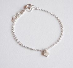 This cute and minimalist silver star bracelet would be a precious gift for a new baby, first birthday, baptism, children gift, or any occasions. This tiny & adorable bracelet is made with sterling silver chain adorned with one tiny Silver Star. ➵ The bracelet size is adjustable thanks to 3 cm extender chain, but if you need personalised size just ask me for this option when you order. ➵ All childrens jewels: https://www.etsy.com/shop/silverbirdjewels?ref=seller-platform-mcnav&section_id= Dainty Sterling Silver Bracelet With Star Charm, Minimalist Bracelets With Star Charm, Silver Star Bracelets For Everyday, Sterling Silver Bracelets With Star Charm As A Gift, Dainty Silver Bracelet With Star Charm, Tiny Sterling Silver Minimalist Bracelet, Sterling Silver Star Bracelet As Gift, Dainty Sterling Silver Bracelets For Birthday, Dainty Silver Star Bracelets