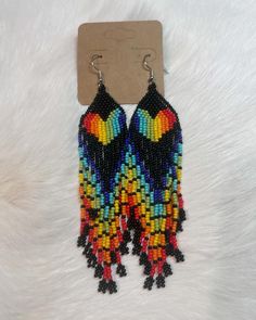 This is a beautiful pair of fringed rainbow earrings. Very lightweight, Rainbow Fringe Earrings As Gift, Rainbow Beaded Fringe Earrings For Gift, Rainbow Dangle Earrings For Summer, Multicolor Tassel Drop Earrings, Rainbow Fringe Dangle Earrings, Rainbow Dangle Tassel Earrings Gift, Rainbow Dangle Earrings With Fringe, Rainbow Tassel Earrings For Gifts, Bohemian Rainbow Beaded Earrings With Fringe