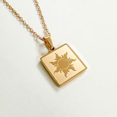 Inspired by our favorite girl Punzie, this Lost Princess Necklace is for everyone out there who’s got a dream! This necklace is dainty and great for minimal everyday wear! Necklace chain is 18" with lobster clasp. Pendant is 1/2" square. Pairs perfectly with our Best Day Ever necklace, tee, hoodie or crewneck! Everyday Charm Necklace With Delicate Rectangular Pendant, Tarnish Resistant Square Pendant Jewelry For Everyday, Minimalist Nickel-free Square Pendant Jewelry, Everyday Rose Gold Square Pendant Jewelry, Everyday Rose Gold Necklace With Rectangular Pendant, Everyday Stainless Steel Charm Necklace With Delicate Chain, Everyday Rectangular Charm Necklace With Delicate Chain, Everyday Tarnish-resistant Square Pendant Necklace, Everyday Rose Gold Necklace With Square Pendant