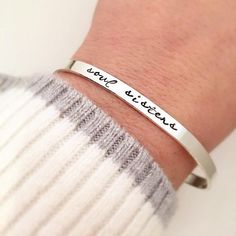 "Soul Sister Bracelet - sterling silver cuff bracelet - gift for her - skinny cuff - stacking bracelets - BFF gift - Friendship bracelet One 1/8\" x 6\" sterling silver cuff bracelet made from 16 gauge sterling silver sheet. It is hand stamped with the phrase soul sisters Need multiples for your bridesmaids? No problem, you can choose your quantity from the drop down box during checkout! As with all hand stamped jewelry, each piece is made just for you, so there may be slight differences. This i Customizable Silver Cuff Bracelet As Friendship Gift, Gold Hand Stamped Cuff Bracelet For Friendship, Hand-stamped Gold Bracelet For Best Friend, Silver Hand-stamped Cuff Bracelet For Friendship, Adjustable Stamped Meaningful Cuff Bracelet, Sisters Bracelet, Bracelets Bff, Bff Birthday Gift, Bff Birthday