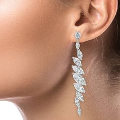 5 CTTW Marquise Cubic Zirconia linear drop earrings. Set in Rhodium or Gold plated brass. Pierced ear.  2.75"L X .5"W Style #: CZ-KE1735_CL Pierced Ear, Earrings Set, Ear Piercings, Cubic Zirconia, Gold Plate, Plating, Brass, Drop Earrings, Gold