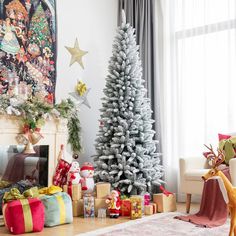 a living room decorated for christmas with presents on the floor and a tree in the corner