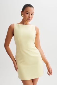 (Not) all business.ANGELA is a sleeveless mini dress with a clean boat neckline and A-line skirt. Crisp and modern, the front features contoured seam lines for a fresh, fitted look. The dress closes with an invisible zip to keep the silhouette smooth, sleek, and sexy. A beautiful blend of stylish and classy, this dress is a versatile wardrobe essential. Accessorise with an oversized blazer, clean earrings, and elegant heels like Geneva Square Diamante Mules. This dress is considered a Micro Mini A Line Dress Aesthetic, Yellow Dress Outfit Classy, Clean Earrings, Meshki Dresses, How To Clean Earrings, Dresses Date Night, Black Dress Prom, Elegant Heels, Timeless Dress