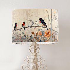 A trio of cute birds sitting on a branch in a woodland glen.  Its called Beneath the Canopy ABOUT ------------- The fabric is printed to order by a small family company in London and then sent to us.  Your lampshade is then carefully handcrafted to order to the highest standard in our rural workshop in the south west of the UK. Edges are meticulously hand rolled, and each illustration is designed to specifically fit your selected size of shade.  This lampshade has a white fire retardant lining. Bird Lampshade, Birds On Branch, Birds Sitting, Drum Lamp Shade, Drum Lamp, Bird On Branch, Fire Retardant, Drum Lampshade, Country Home Decor