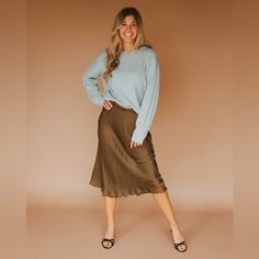 Olive Satin Midi Skirt With Elastic Waist And Fringe Hem. 55% Viscose 45% Rayon Model Is 5'6" And Wearing A Small. Fit Tip: Standard Fit Size Guide For This Item: S: Chest: 34-35" Waist: 27-28" Hips 36-37" M: Chest 36-37" Waist: 29-30" Hips 38-39" L: Chest 38-39" Waist: 31-32" Hips 40-41" Satin Midi Skirt, Women Skirts Midi, Size Guide, Midi Skirt, Elastic Waist, Womens Skirt, Satin, Elastic, Skirt