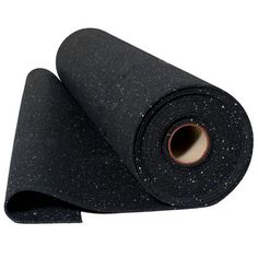 a roll of black yoga mat with white speckles on the top and bottom