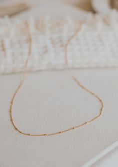 A sweet + delicate layering chain. Offered in 16", 18" or 20" lengths. Available in 14kt Gold Fill + Sterling Silver. Our jewelry is handmade so each piece will be unique and may vary slightly from what is pictured. Dainty 14k Gold Necklace With Delicate Chain, Everyday Delicate Station Necklace With Delicate Chain, Delicate Station Necklace For Everyday Wear, Delicate 14k Gold-filled Link Necklace, Dainty Cable Chain Station Necklace As Gift, Dainty Station Necklace With Satellite Chain As Gift, Dainty Station Necklace With Cable Chain As Gift, Delicate 14k Gold Filled Link Necklace, Dainty 14k Gold Station Necklace With Cable Chain